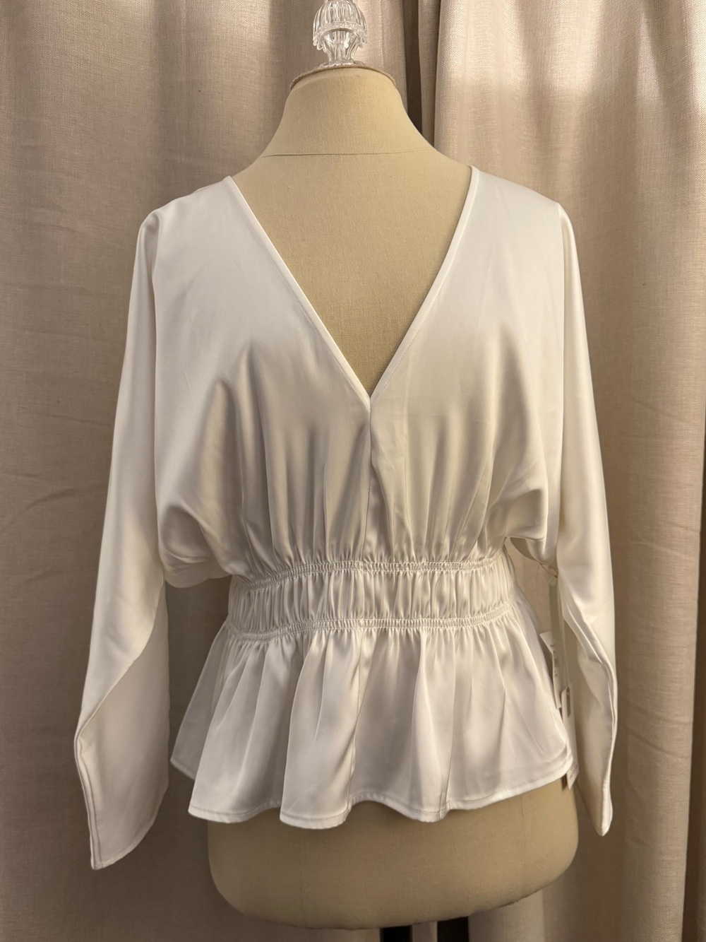 Good American Deep V-Neck Dolman Sleeve Satin Top in Ivory.